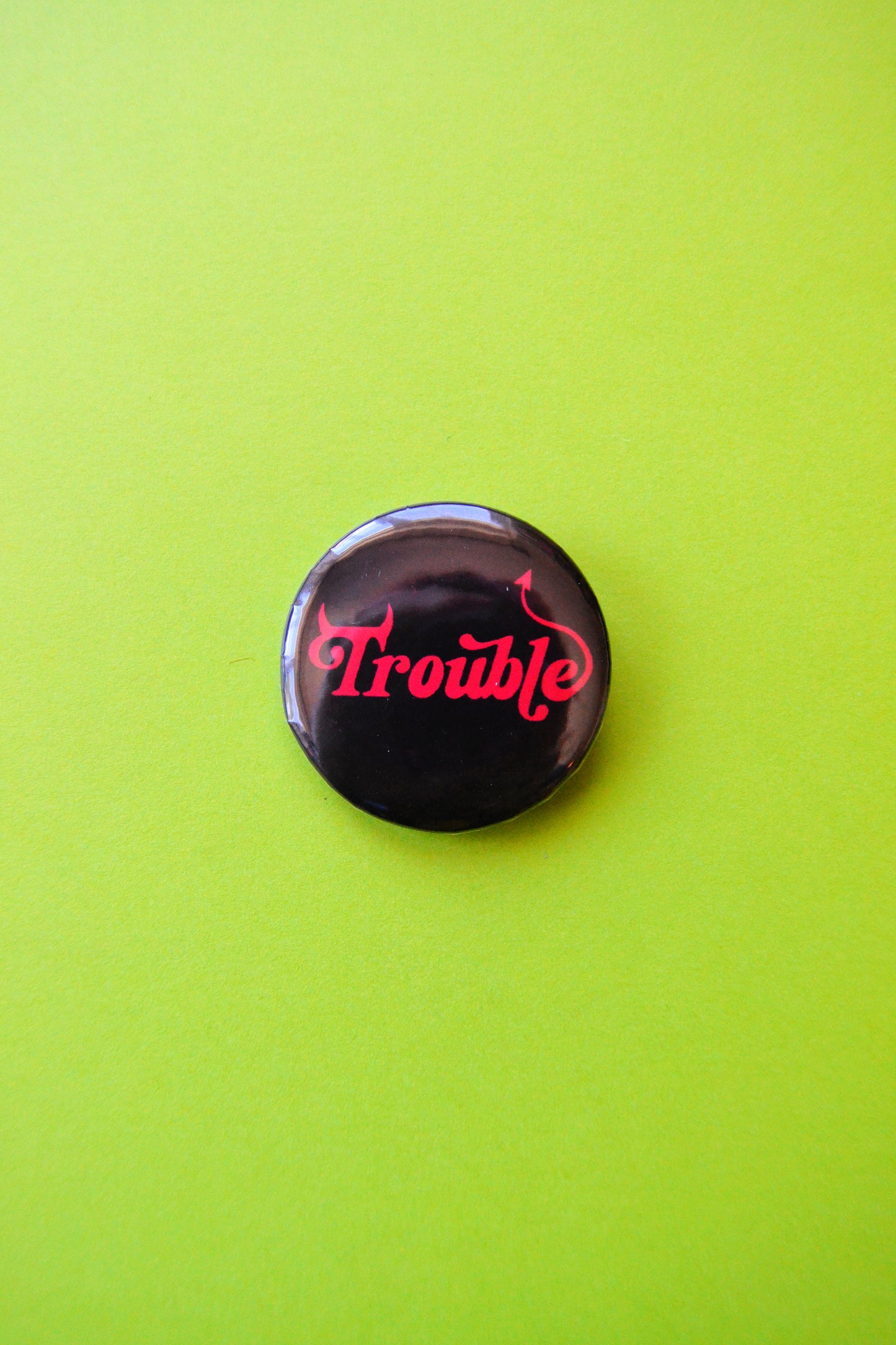 Trouble Pinback Button