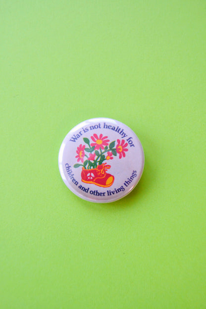 War is Not Healthy For Children Reproduction Button