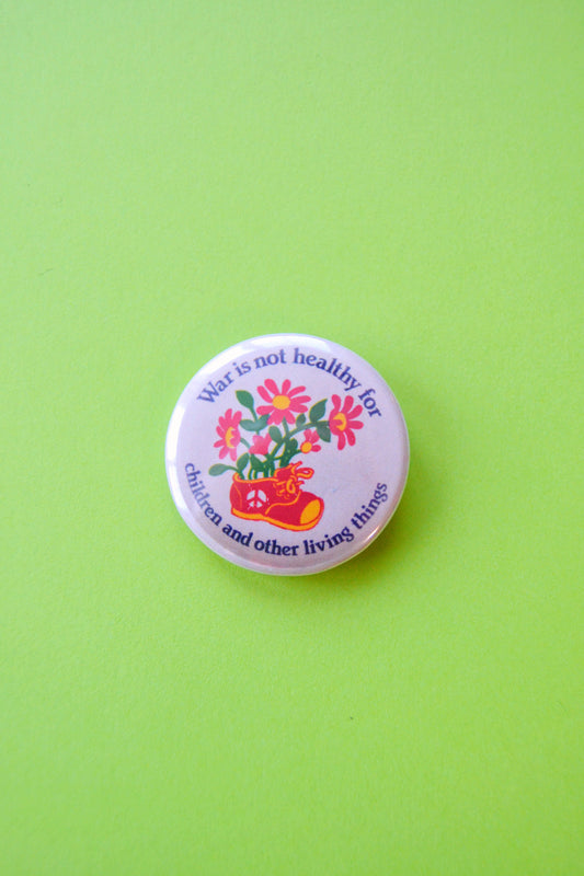 War is Not Healthy For Children Reproduction Button