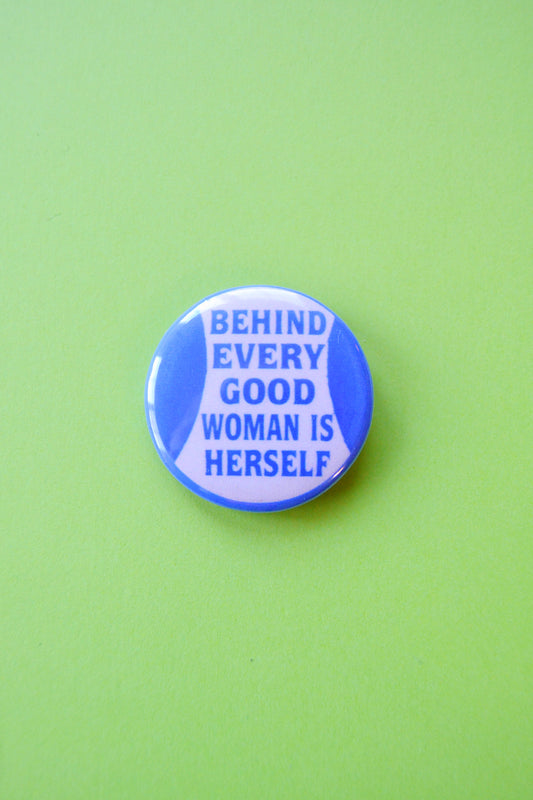 Behind Every Good Woman is Herself Reproduction Button