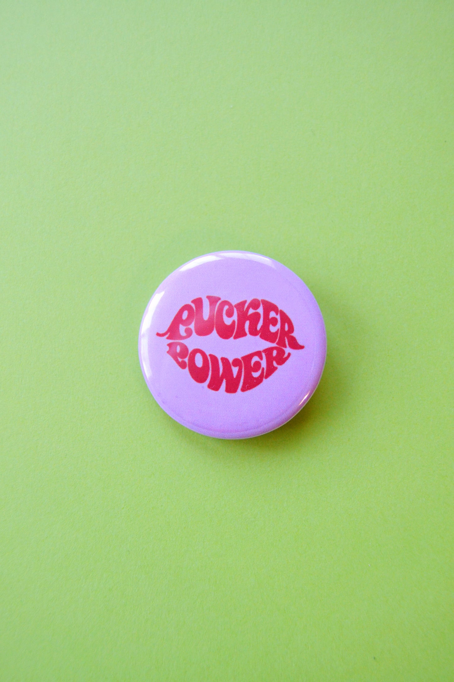 Pucker Power Reproduction Button