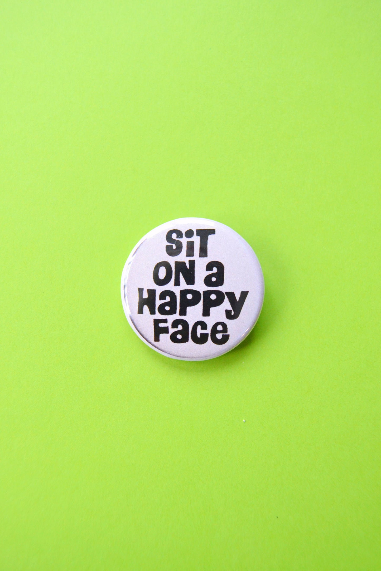 Sit on a Happy Face Reproduction Button