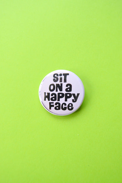 Sit on a Happy Face Reproduction Button