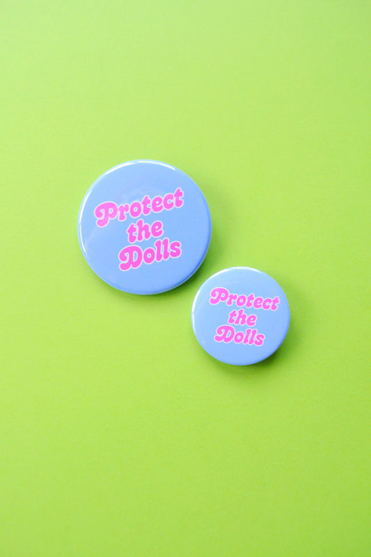 Protect the Dolls Button